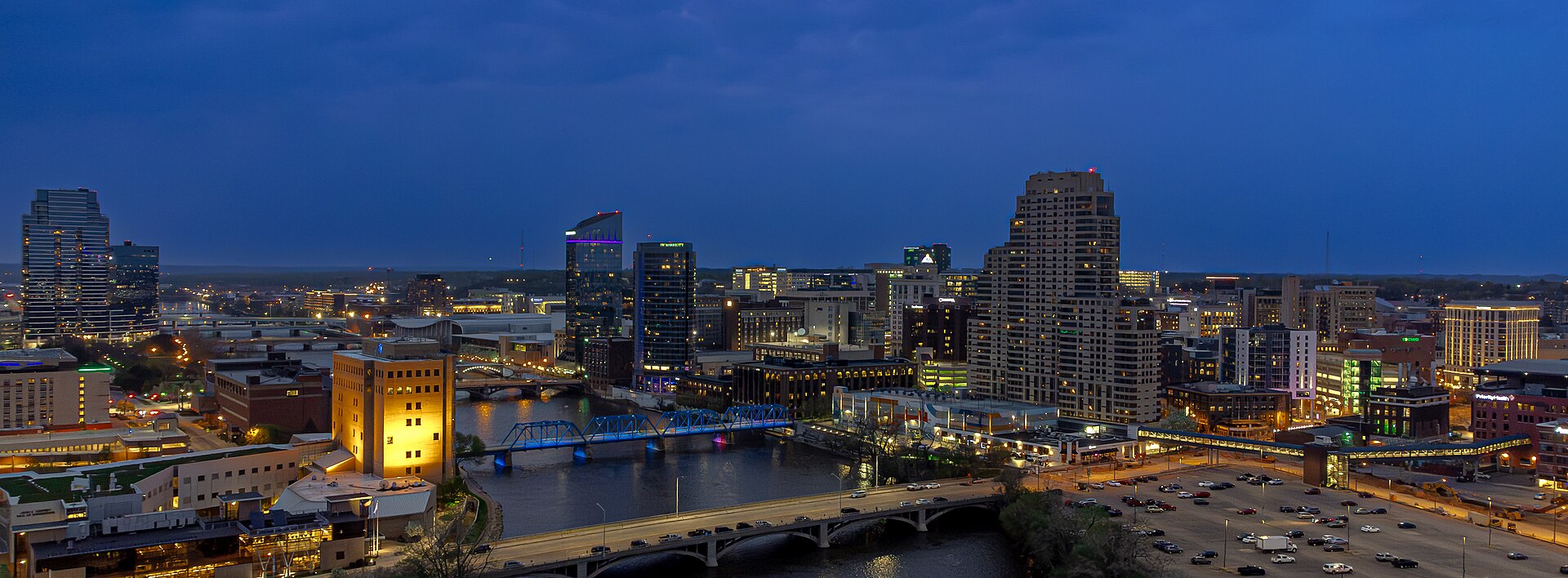 Grand Rapids at blue hour — the lit Blue Bridge and downtown skyline